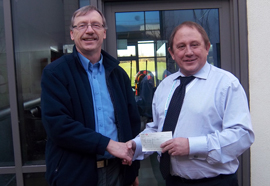 Iain handing over cheque to Steve Oliver of teh TCT